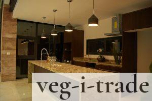 a large kitchen with a marble counter top